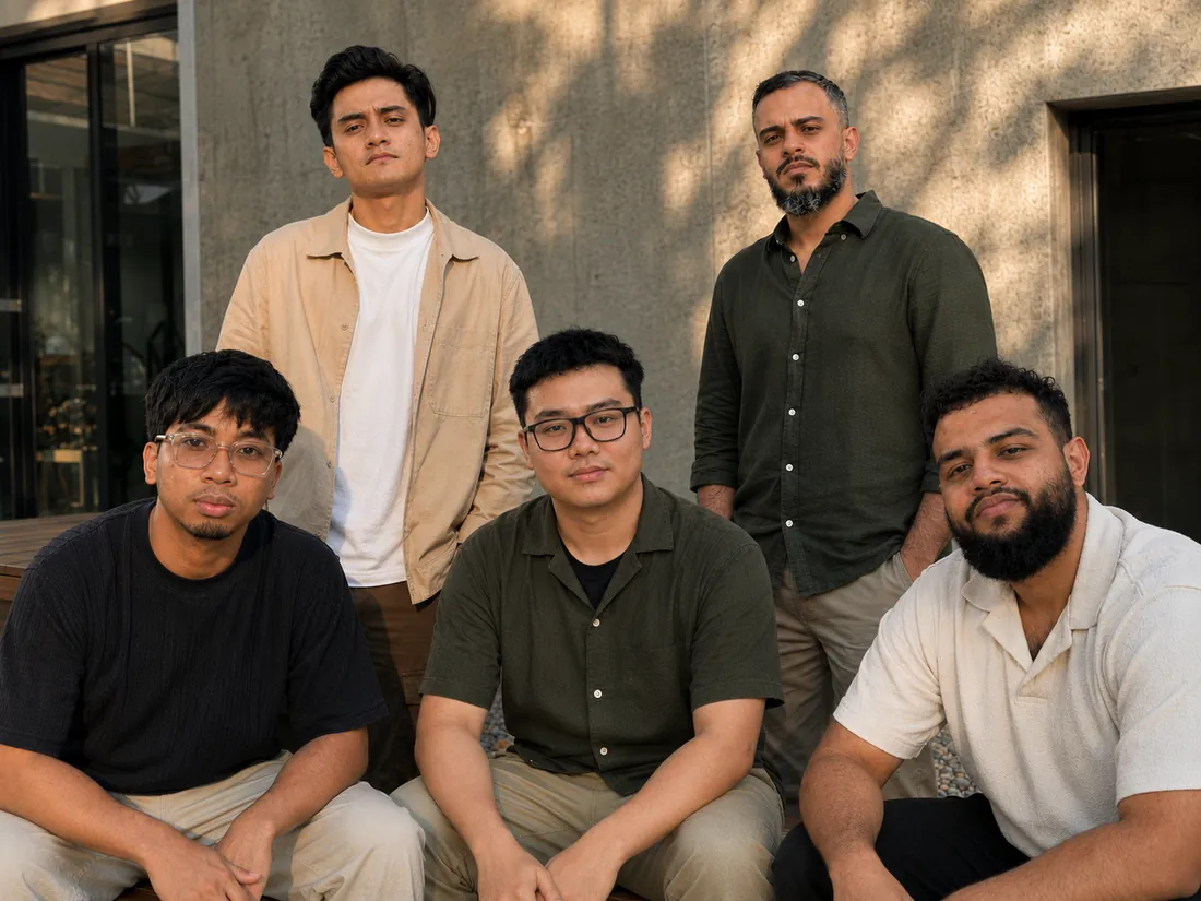 The five-person team who design and build the free websites, photographed together outside their studio